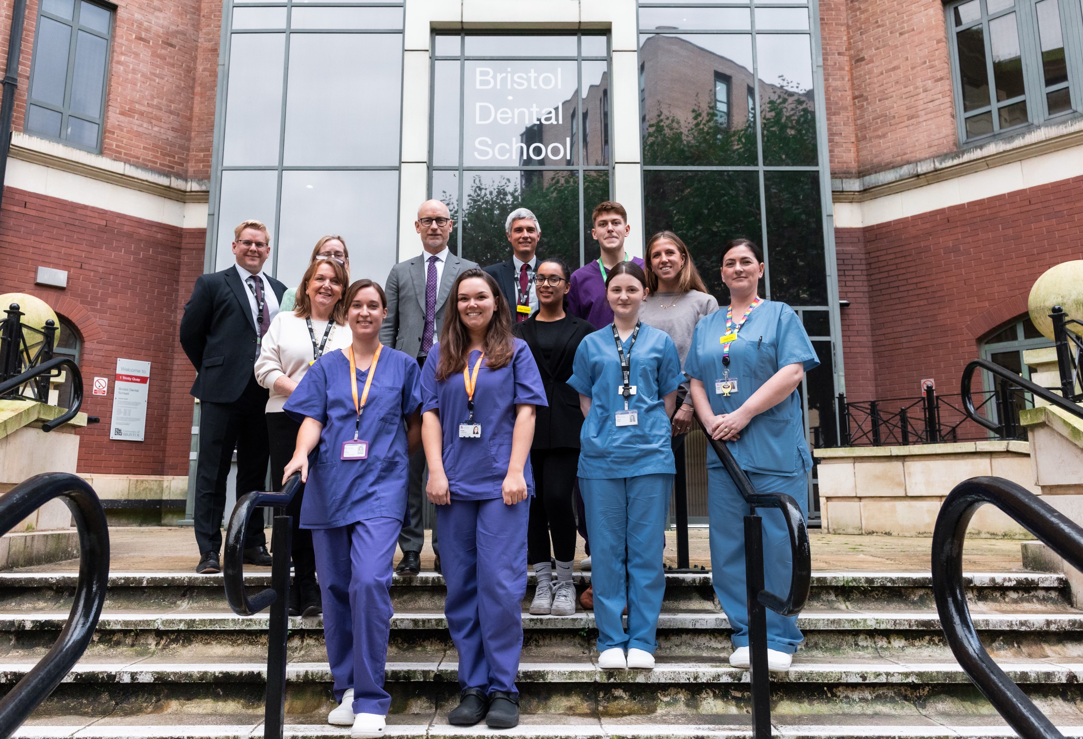 Minister of State for Care, Stephen Kinnock with students and staff, including University of Bristol Vice-Chancellor and President, Professor Evelyn Welch, outside Bristol Dental School.